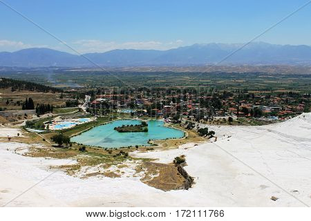 The lovely mountain lake pleases the eyes of tourists on travertine