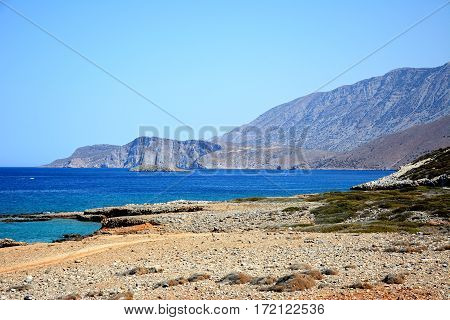 View of the beach and rugged coastline near Ammoudara Crete Greece Europe.