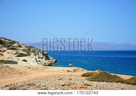View of the beach and rugged coastline near Ammoudara Crete Greece Europe.