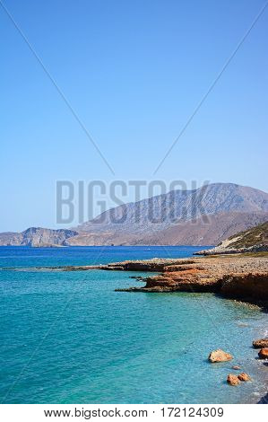 View of the beach and rugged coastline near Ammoudara Crete Greece Europe.