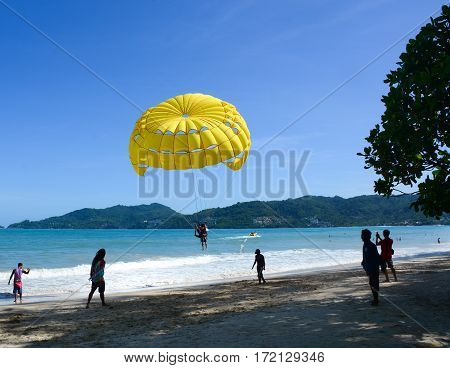 People Playing Parasailing In Phuket, Thailand