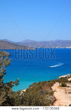 Elevated view of the sea and coastline with mountains to the rear Istro Crete Greece Europe.