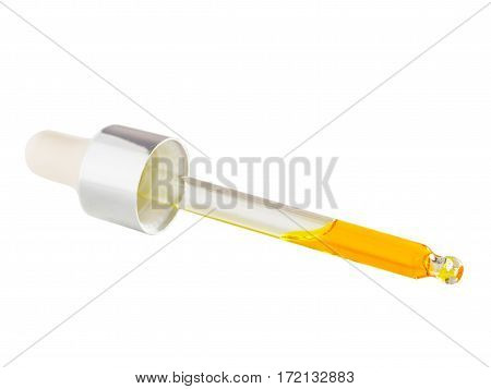 Essential oil or serum in pipette isolated on white background close up