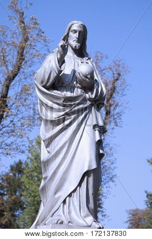 Jesus Christ the teacher (statue on dlue background)