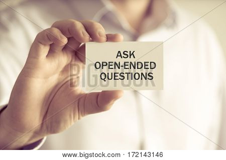 Businessman Holding Ask Open-ended Questions Message Card
