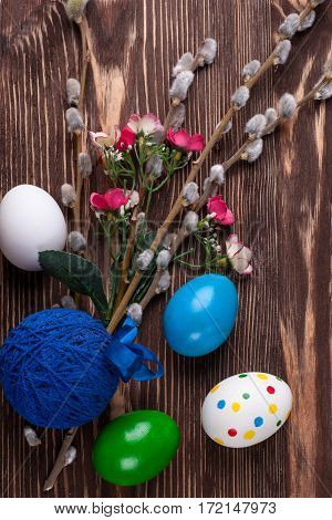 Colorful easter edds on a brown wooden table