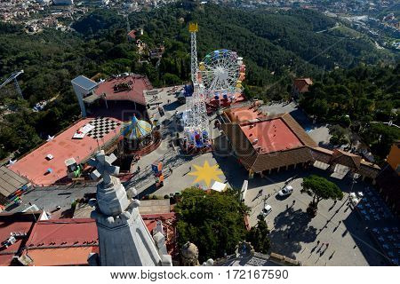Barcelona Spain - December 2 2016: Aerial view of buildings on to of Tibidabo mountain in Barcelona Spain. Unidentified people visible