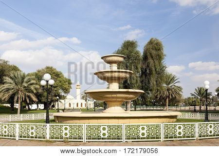 Fountain and mosque at the Hili archaeological park in Al Ain. Emirate of Abu Dhabi United Arab Emirates