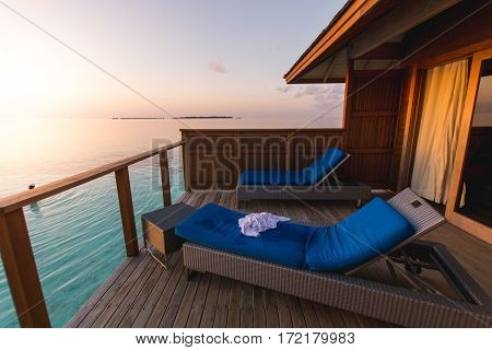 Beautiful tropical Maldives resort hotel and island with beach and sea on sky sunset for holiday vacation background concept - Boost up color Processing.