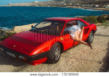 Young Girl Fall Over The Door Of Ferrari