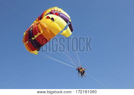 KHORFAKKAN UAE - DEC 1 2016: Parasailing on the beach in Khorfakkan Emirate of Sharjah United Arab Emirates