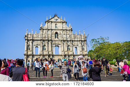 Macao, China - December 9, 2016: Tourists And Local Residents Walk Pass And Take Photos At The Ruins
