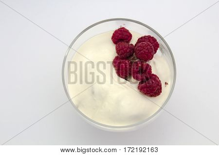 raspberry witth sauer cream in isolated white background