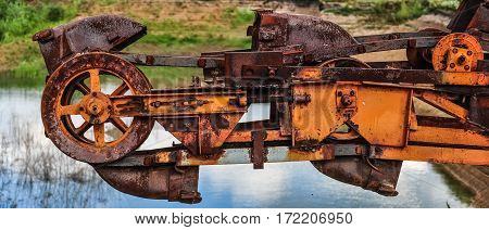 Old rusty multi bucket excavator giant stacker absetzer in career.