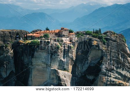 View of The Holy Monastery of St. Stephen on the rock at the complex of Meteora monasteries in Greece. Steep cliffs and mountains in the valley of Thessaly