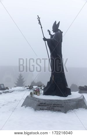 Mount St. Anna Poland - February 4 2016: Statue of Pope John Paul II in the winter fog in the Franciscan monastery on Mount St. Anna in Poland