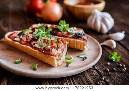 Baguette Pizza With Bacon, Salami, Cheese And Vegetable