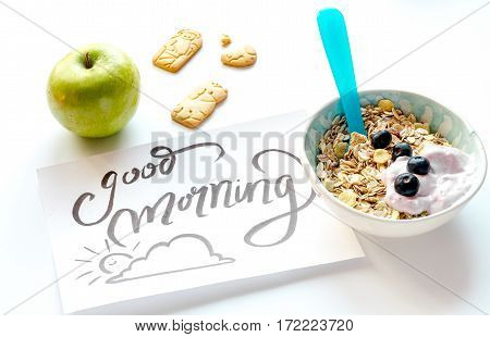 concept kid breakfast with muesli on white background.