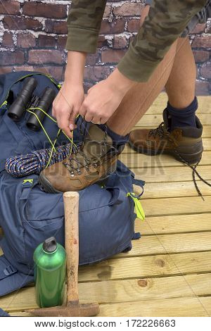 Hiking equipment rucksack boots and backpack. Concept for family hiking. Colorful background.