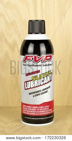 RIVER FALLS,WISCONSIN-JANUARY 19,2017: A can of FVP brand silicon lubricant against a wood background.