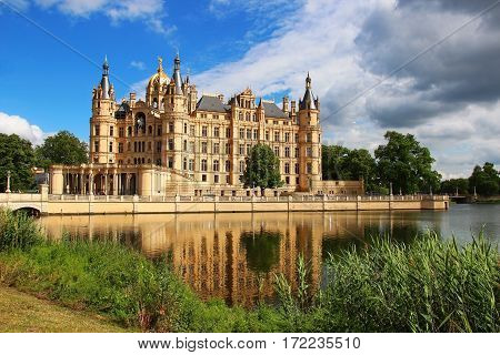 Schwerin Castle (Schweriner Schloss) reflected in the lake, Germany