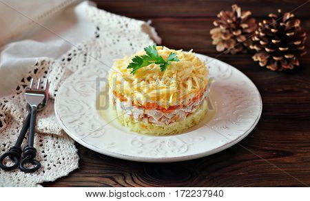 Salad of boiled potatoes, carrots, eggs, hard cheese, smoked chicken breast and white onion with mayonnaise. Russian traditional festive salad.