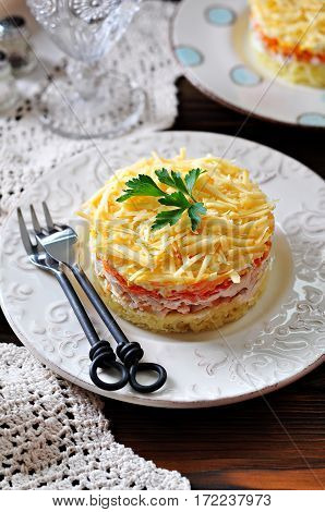 Salad of boiled potatoes, carrots, eggs, hard cheese, smoked chicken breast and white onion with mayonnaise. Russian traditional festive salad.