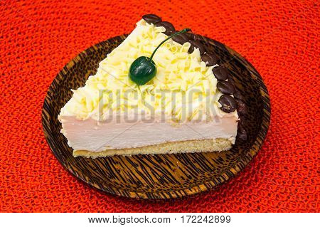 Cake piece Pigeon milk on plate. Stdio Photo