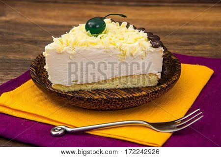 Cake piece Pigeon milk on plate. Stdio Photo