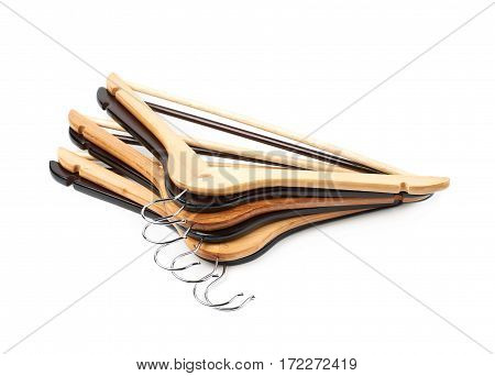 Pile of wooden hangers isolated over the white background