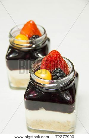 A Blueberry filling and creamcheese served in glass
