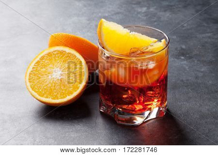 Negroni cocktail on dark stone table
