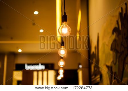 old bulb electric  lamp hang over a ceiling