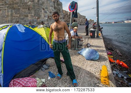 KOS ISLAND, GREECE - SEP 27, 2015: Unknown refugees arriving in Greece by inflatable boats from Turkey. Kos island is located just 4 kilometers from the Turkish coasts.