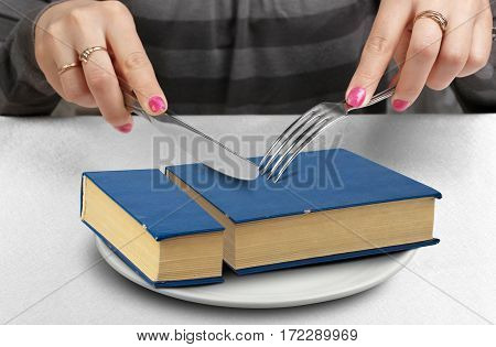 education creative concept cut book on plate