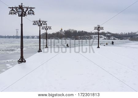 Winter landscape on a Dnepr river embankment in center of Dnepr city Ukraine