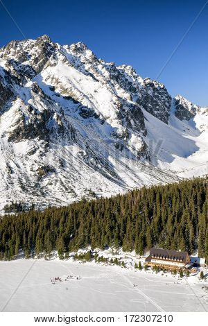 Snowy frozen lake Popradske pleso in winter High Tatras mountains Slovakia