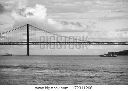The 25 de Abril Bridge (25th of April Bridge) is a suspension bridge connecting the city of Lisbon capital of Portugal to the municipality of Almada on the left (south) bank of the Tagus river