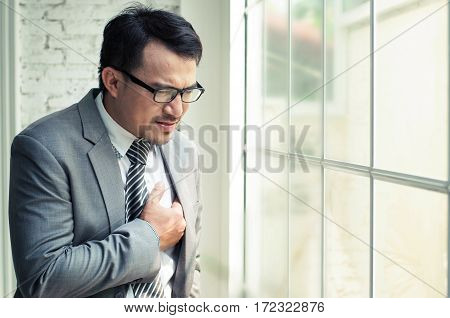 Businessman be ill and heart failure when he work hards at his offiice.