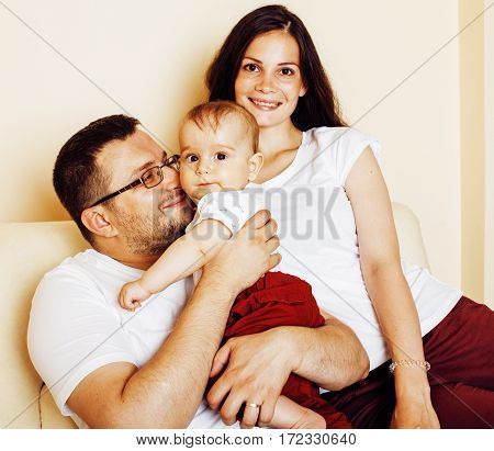 young happy modern family smiling together at home. lifestyle real people concept, father holding baby son