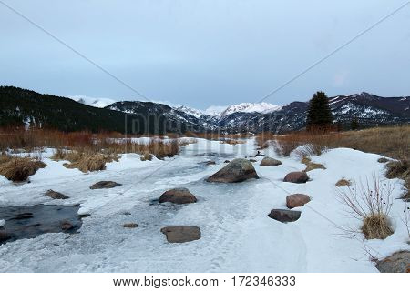 Snow and ice cover Moraine Park along the Big Thompson River in Rocky Mountain National Park