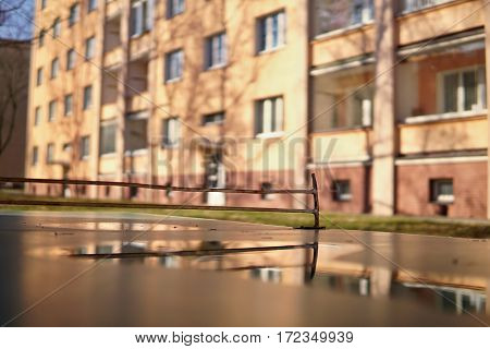 Abstract detail of old ping pong (table tennis) table placed in the middle of aged housing project as a symbol of sport activities placed in older districts