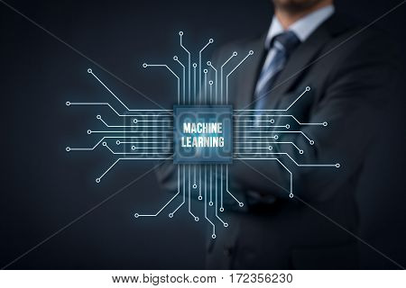 Machine learning, data analysis concept. Businessman or programmer with abstract symbol of a chip with text machine learning connected with data represented by points.