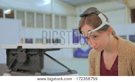 Concentrated woman playing mind control game. Future and technology concept