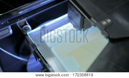 Three dimensional printing machine. 3D printer during work