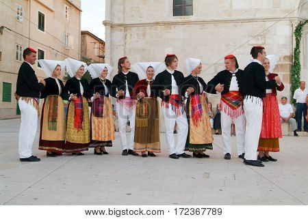 People On Traditional Clothes During A Celebration At Pag