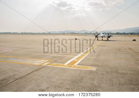 Small Airplane or Aeroplane Parked at Airport.Small Airplane Famous to use Private Airplane.Sun Light and Mountain View.