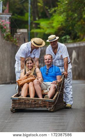 FUNCHAL, MADEIRA - SEPTEMBER 19: Traditional downhill sledge trip on September 19, 2016 in Madeira, Portugal.