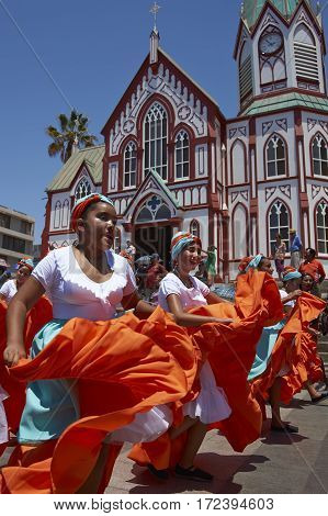 ARICA, ARICA and PARINACOTA, CHILE - FEBRUARY 10, 2017: Female dancers from the group Tumba Carnaval, performing at the annual street carnival celebrating the strength of the sun.