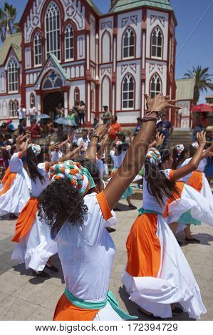 ARICA, ARICA and PARINACOTA, CHILE - FEBRUARY 10, 2017: Female dancers from the group Tumba Carnaval, performing at the annual street carnival celebrating the strength of the sun.